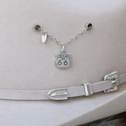 a hat with a necklace and a chain