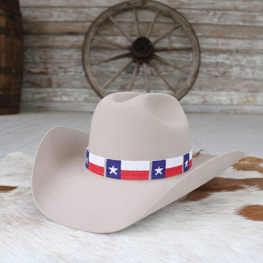 a hat on a cowhide rug