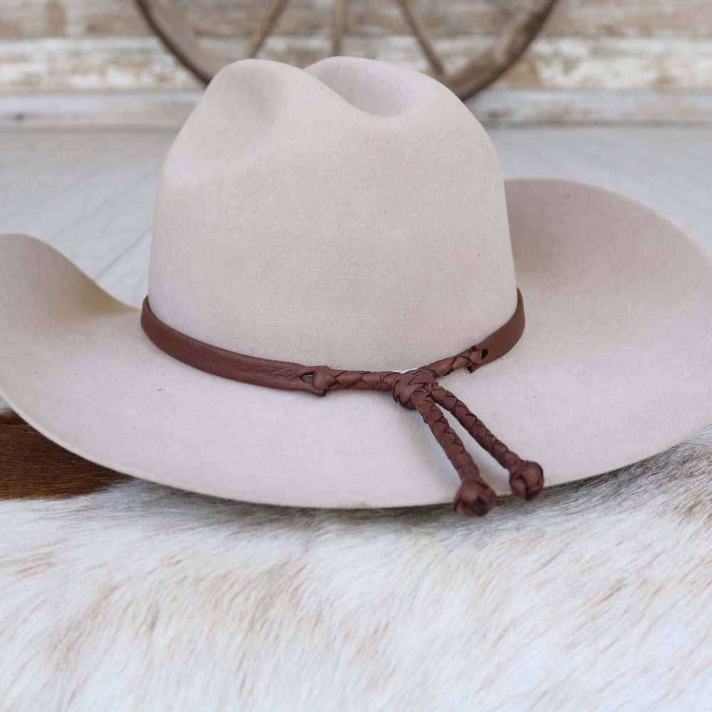 a hat on a white surface