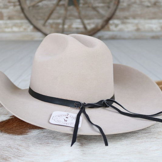 a hat on a cowhide
