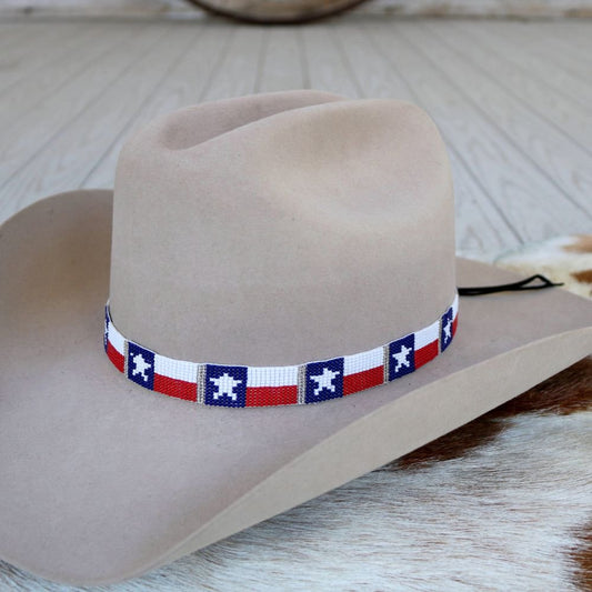 a cowboy hat on a cowhide rug
