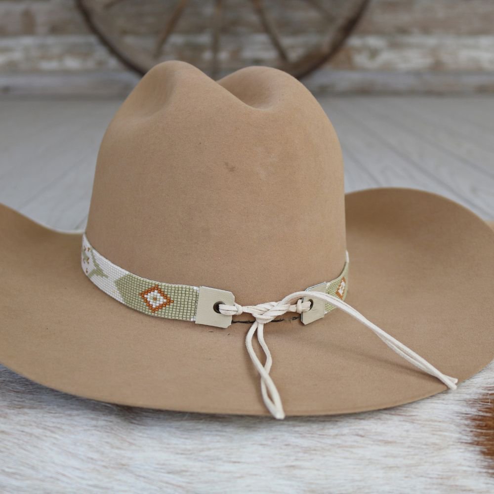 a brown hat with a white band on it