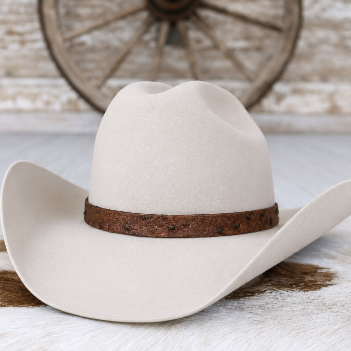 a cowboy hat on a fur rug
