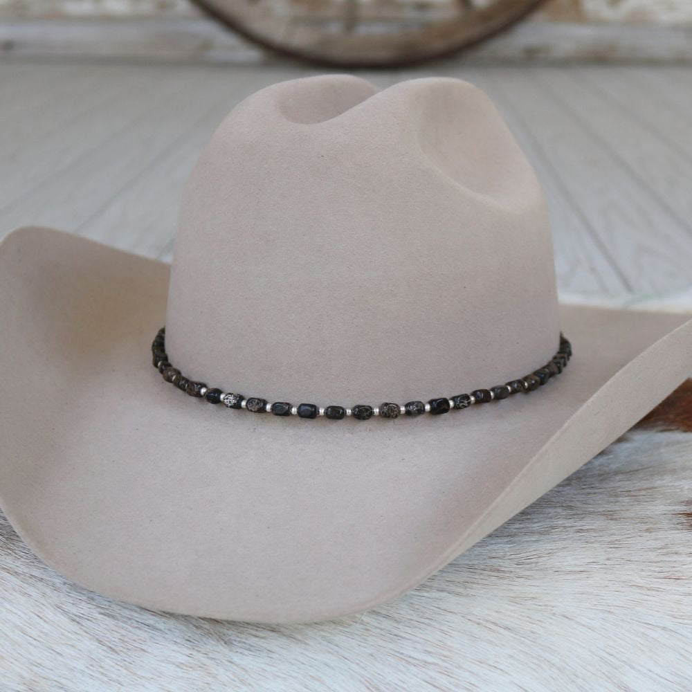 a hat on a white surface