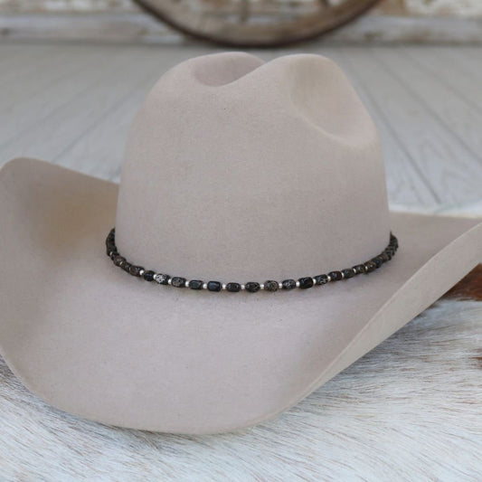 a hat on a white surface