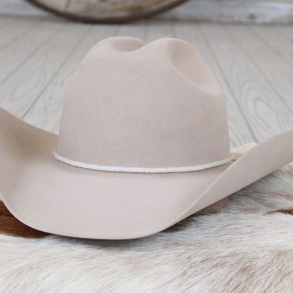 a cowboy hat on a fur rug