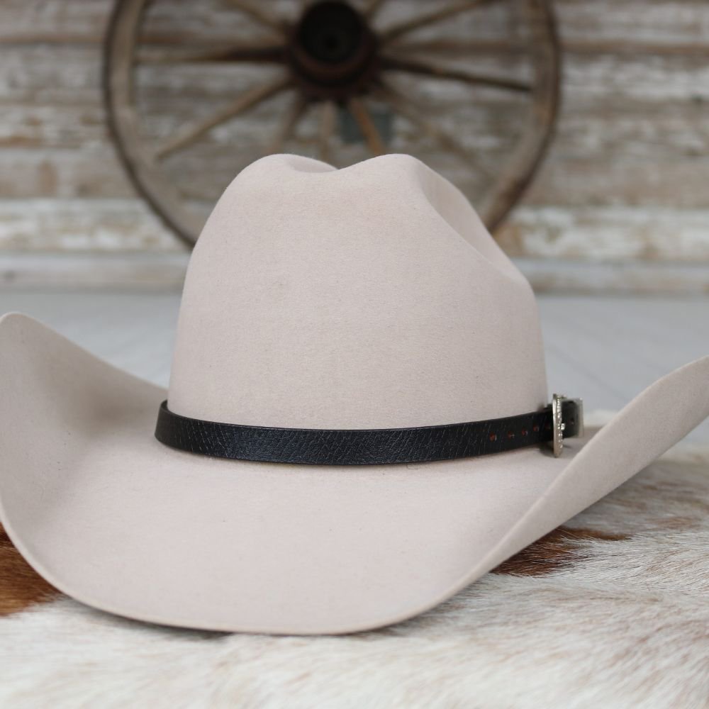 a hat on a cowhide rug