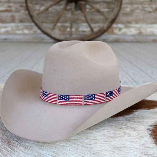a cowboy hat with a flag band