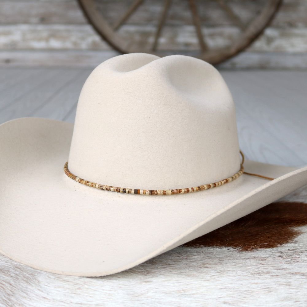 a white cowboy hat on a white surface