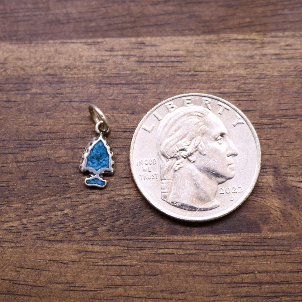 a coin and a pendant