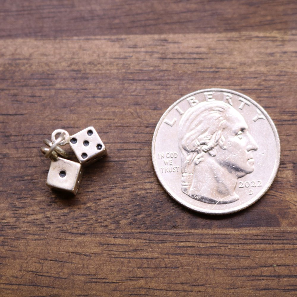 a coin and dice on a table