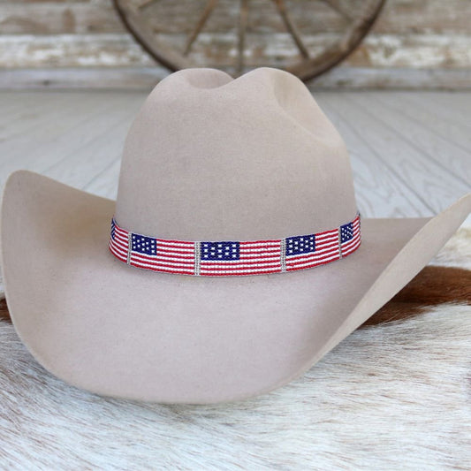 a cowboy hat with a flag band on it