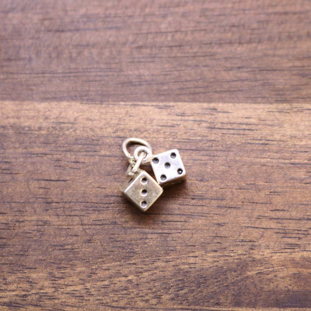 a pair of dice on a wood surface