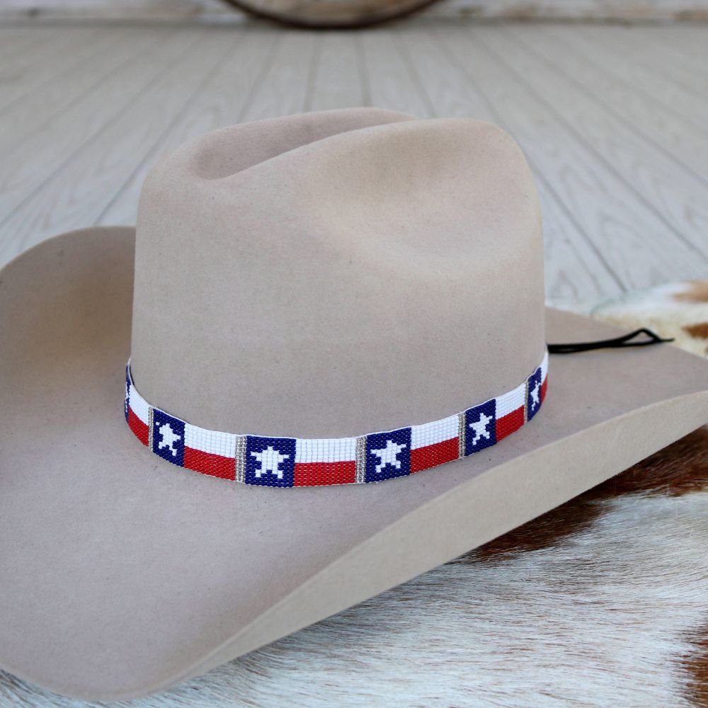 a cowboy hat on a cowhide rug