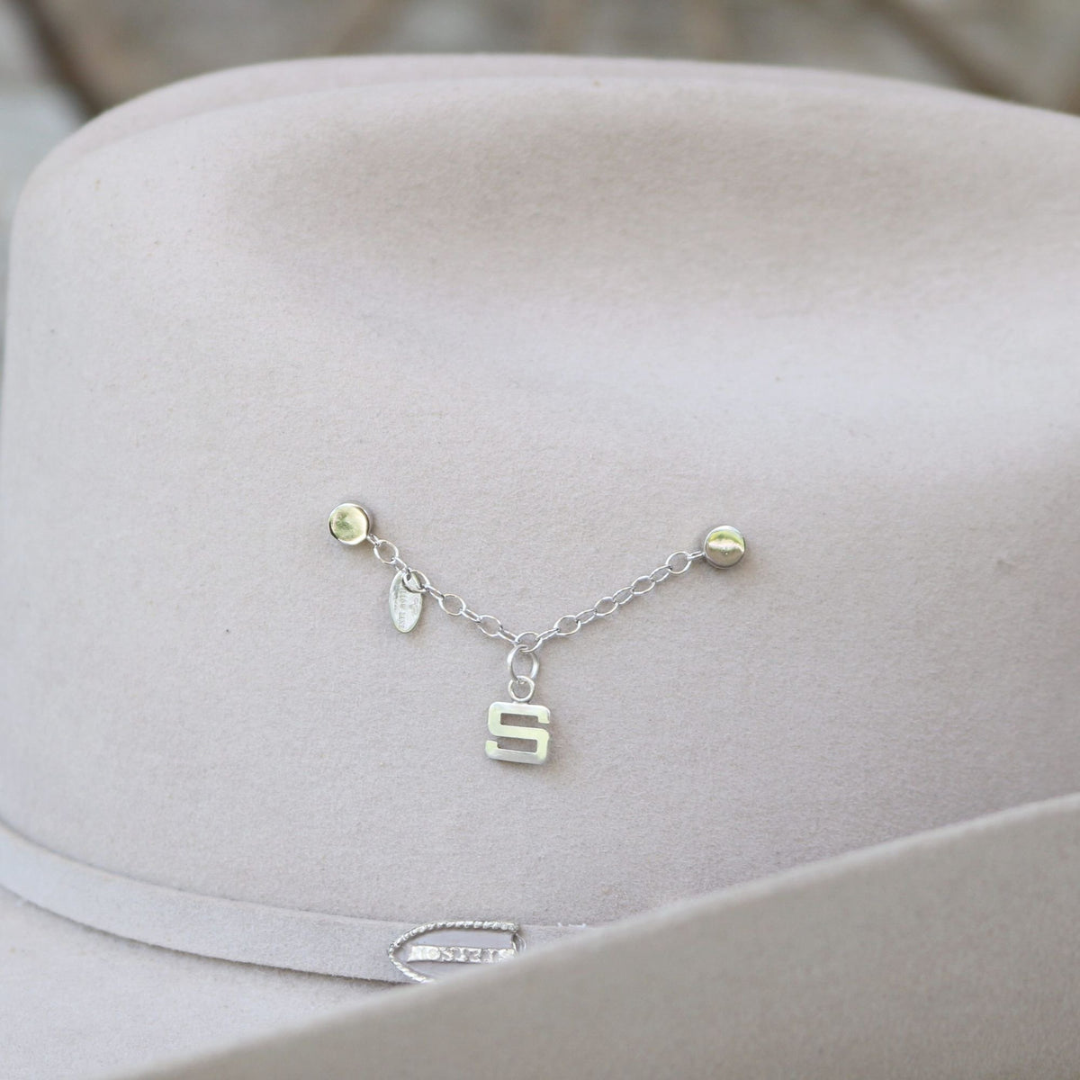 a hat with a necklace