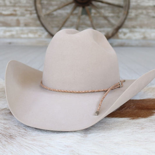 a cowboy hat on a fur rug