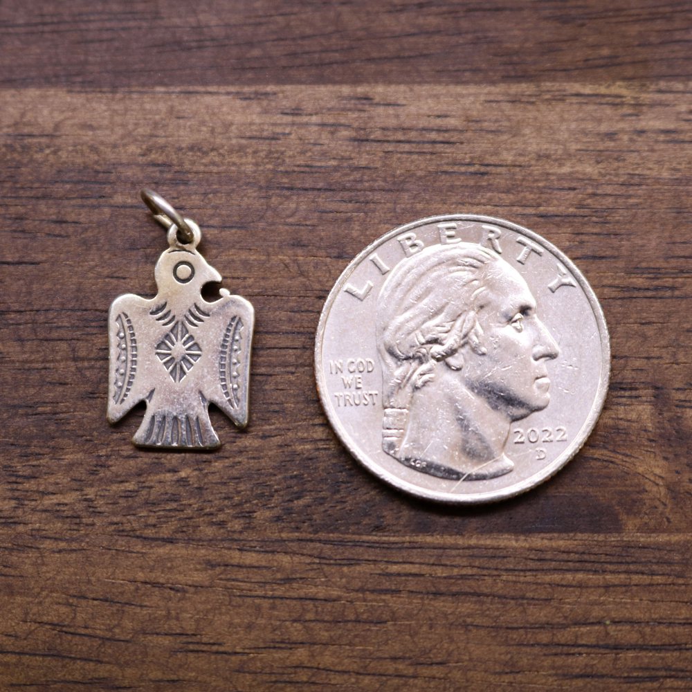 a coin and a pendant