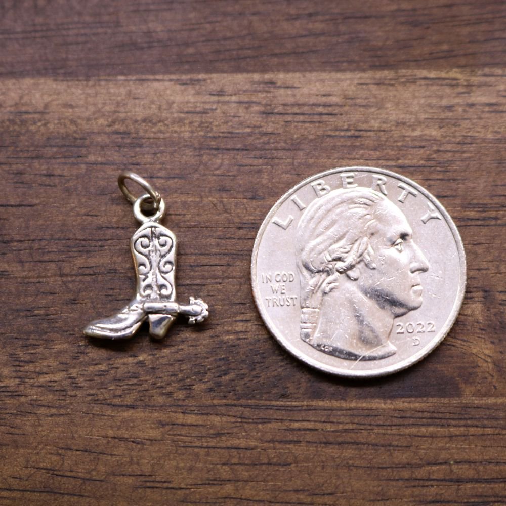 a coin and a boot charm