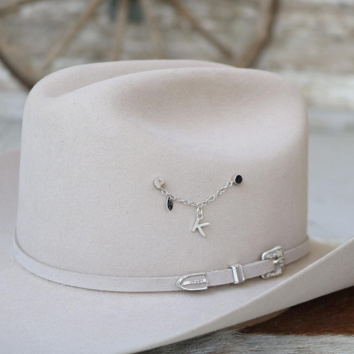 a hat with a necklace on it