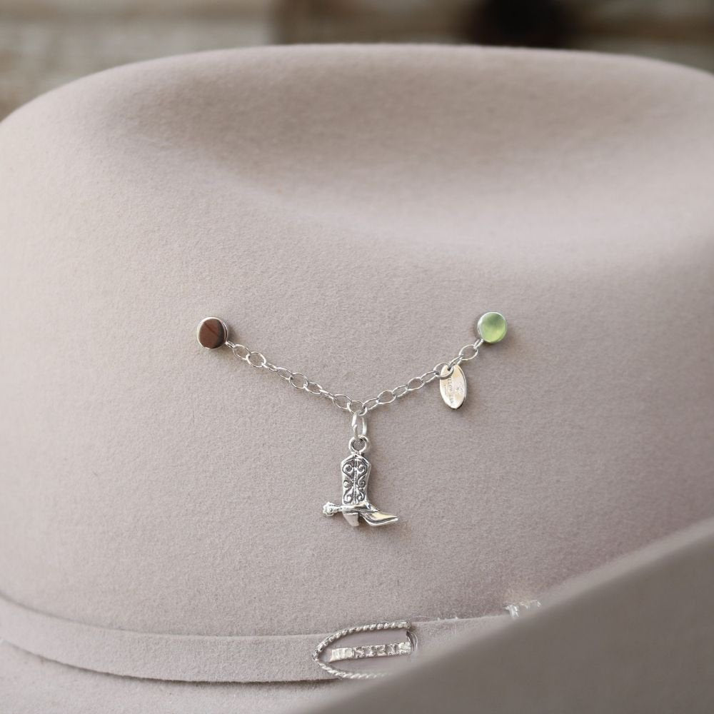 a hat with a necklace on it
