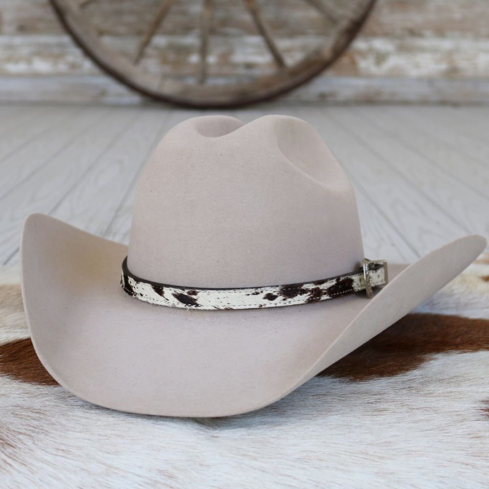 a hat on a cowhide rug