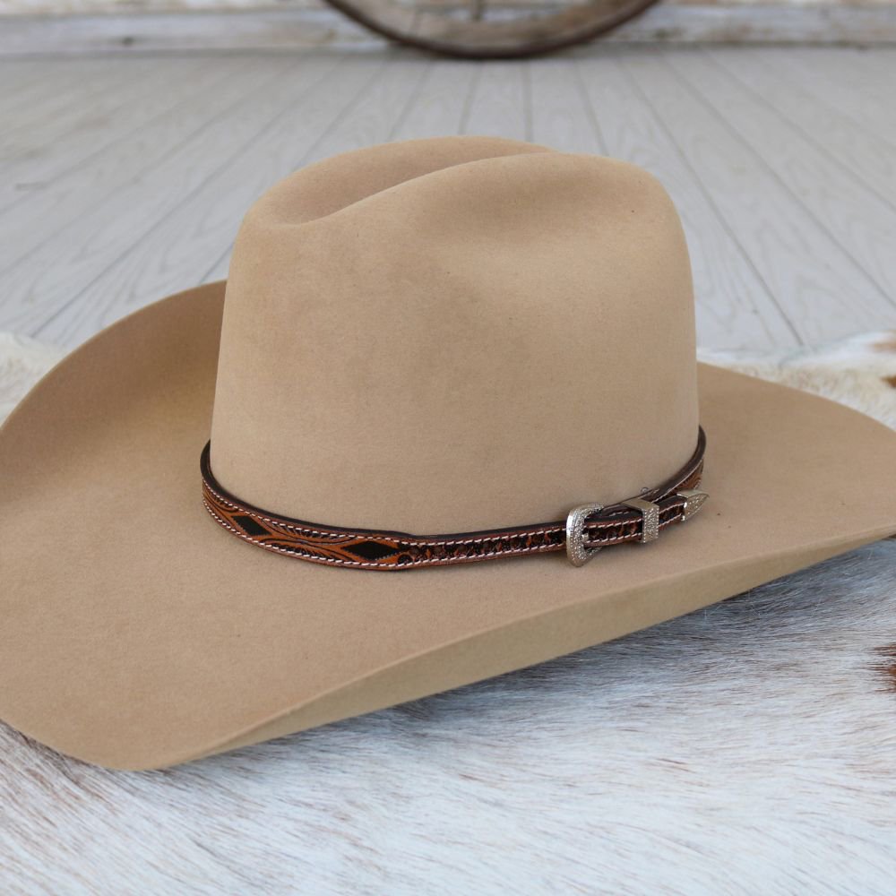 a hat on a white surface