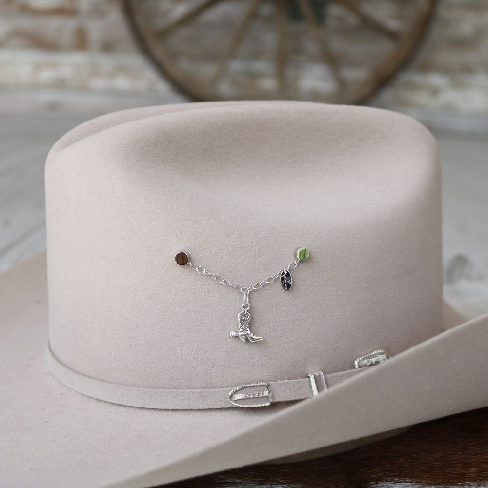 a hat with a necklace on it