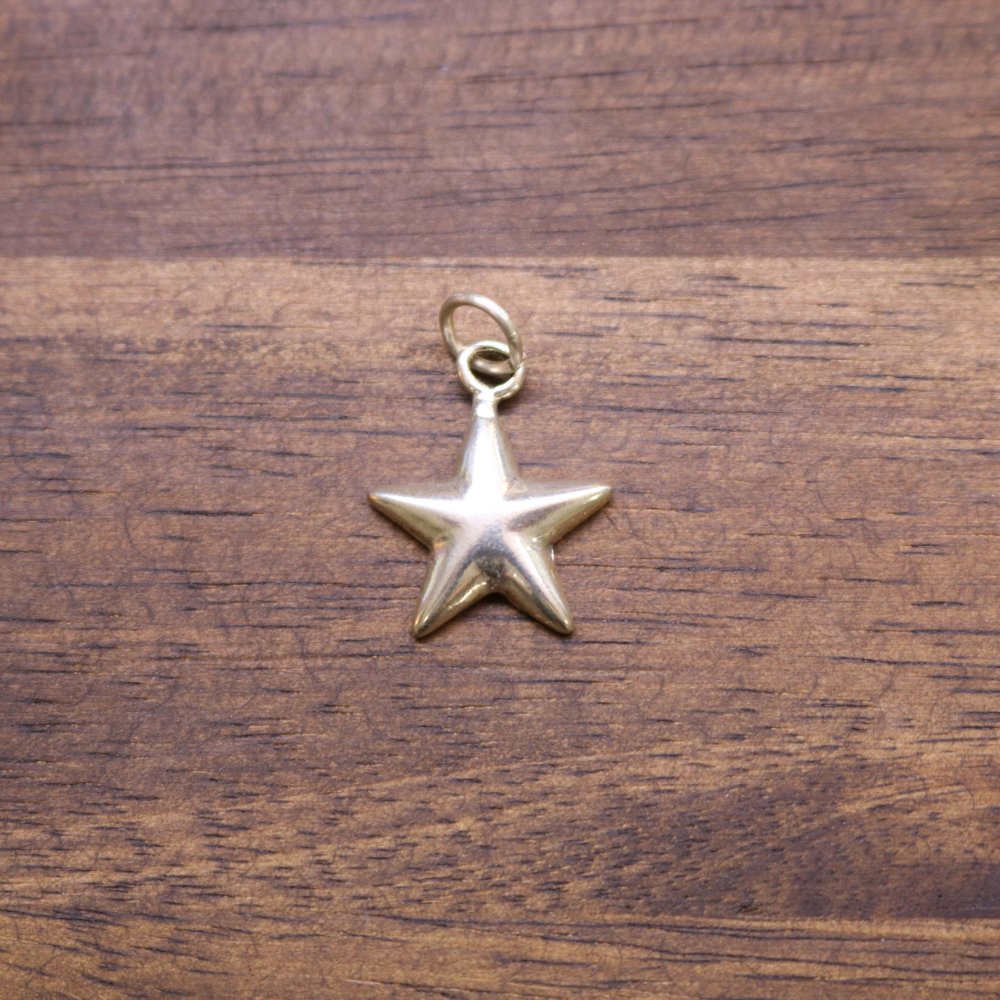 a gold star on a wood surface