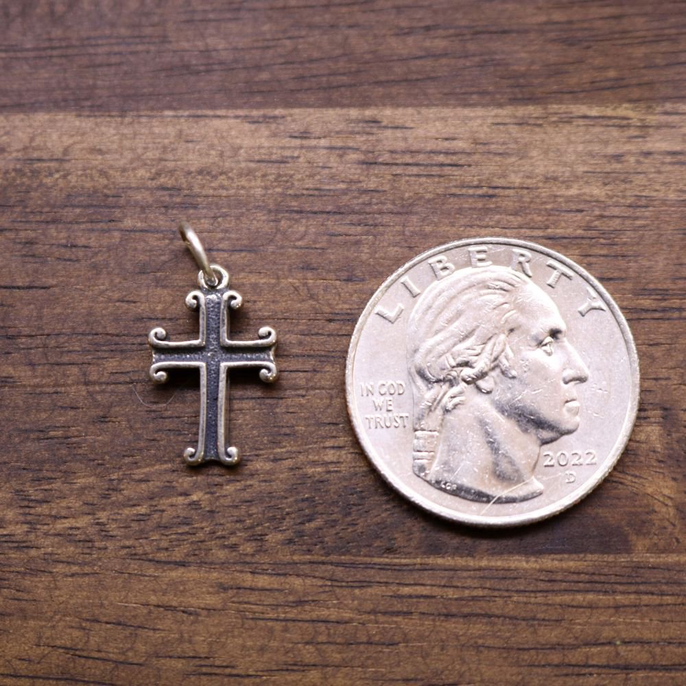 a coin and a cross